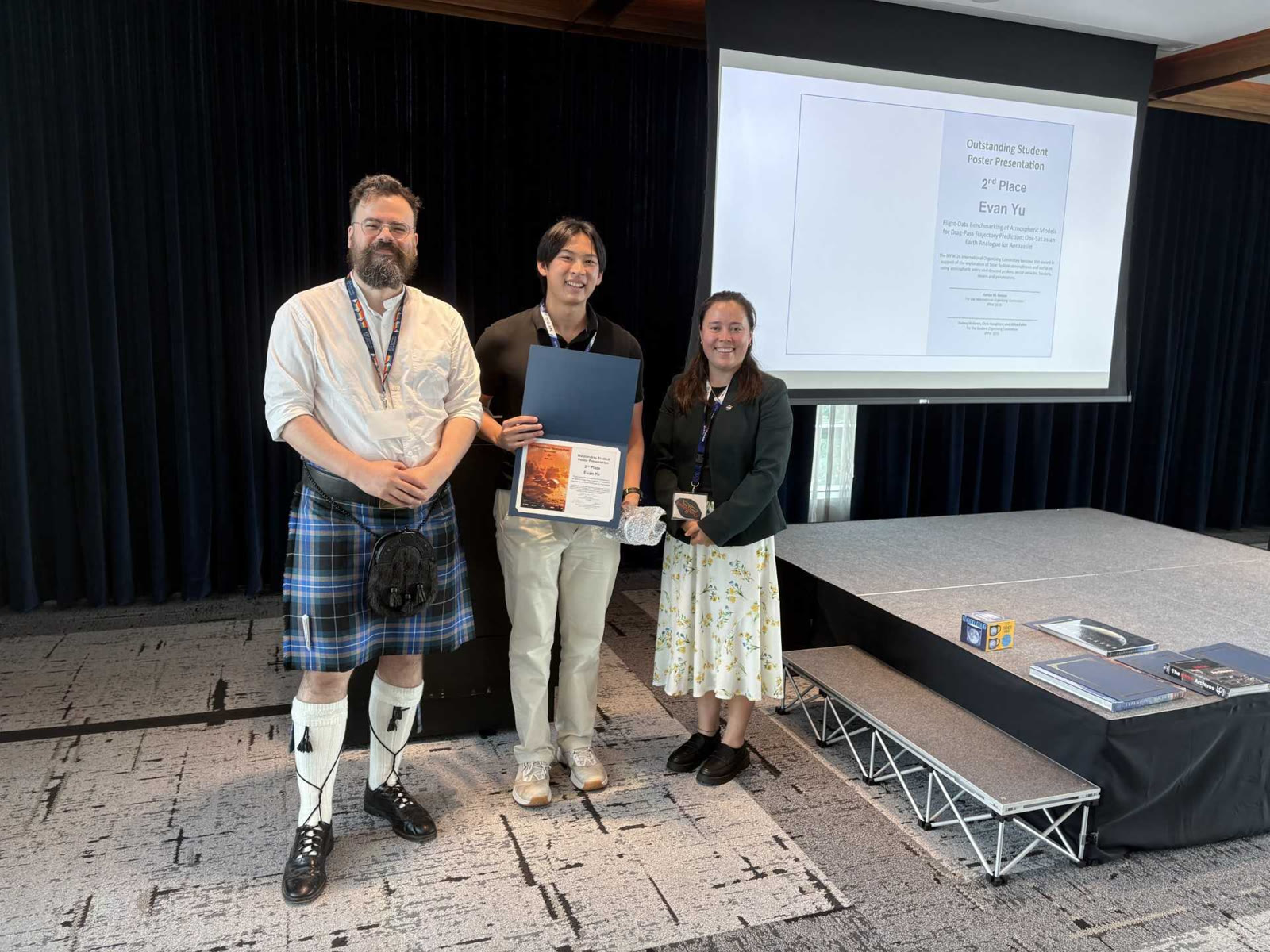 Evan Yu receiving second place in the IPPW 2026 student poster presentation competition