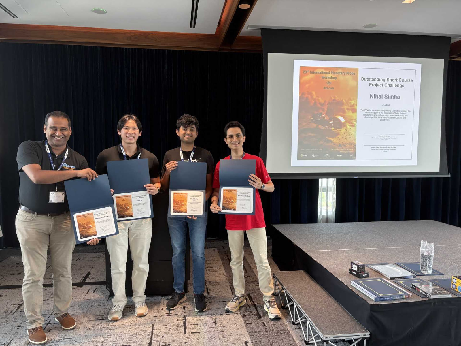 Som Dutta, Evan Yu, Nihal Simha, and Mohammed Fadag at the IPPW 2026 short course awards